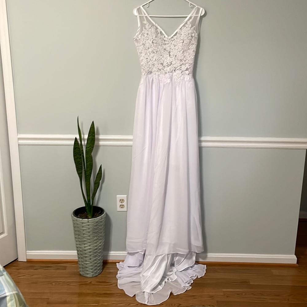 Never worn simple white lace wedding dress. Size small